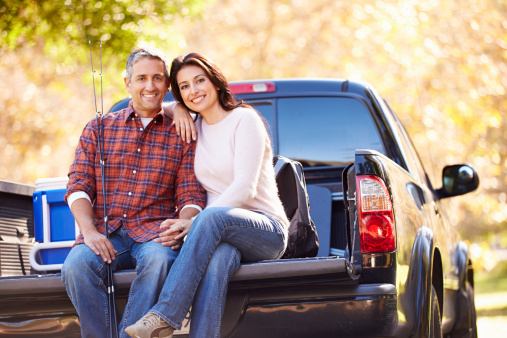 Couple and truck outside in the Fall