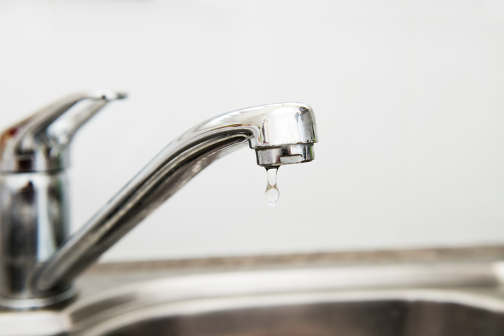 a faucet dripping water