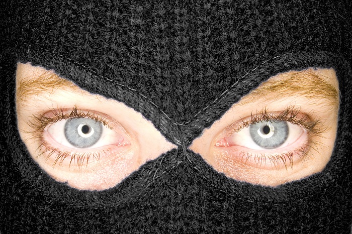 thief with blue eyes in mask