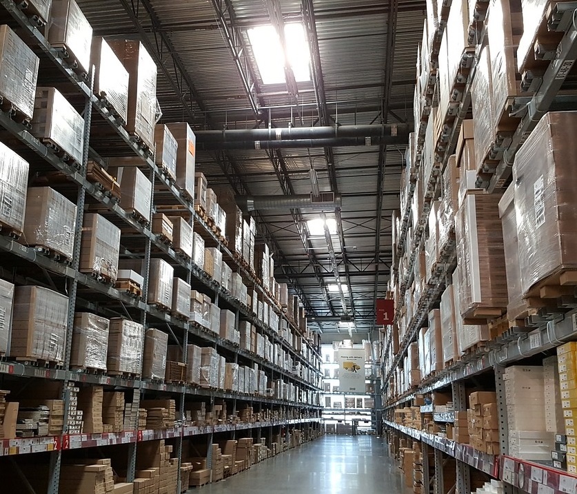 Warehouse shelves warehouse with inventory stacked up on tall shelves