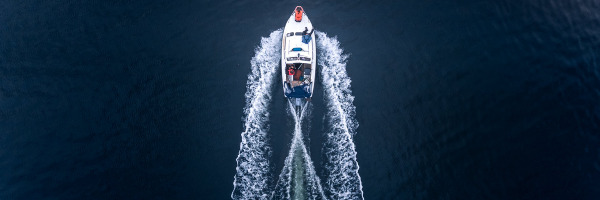 Overhead picture of large boat in dark blue water