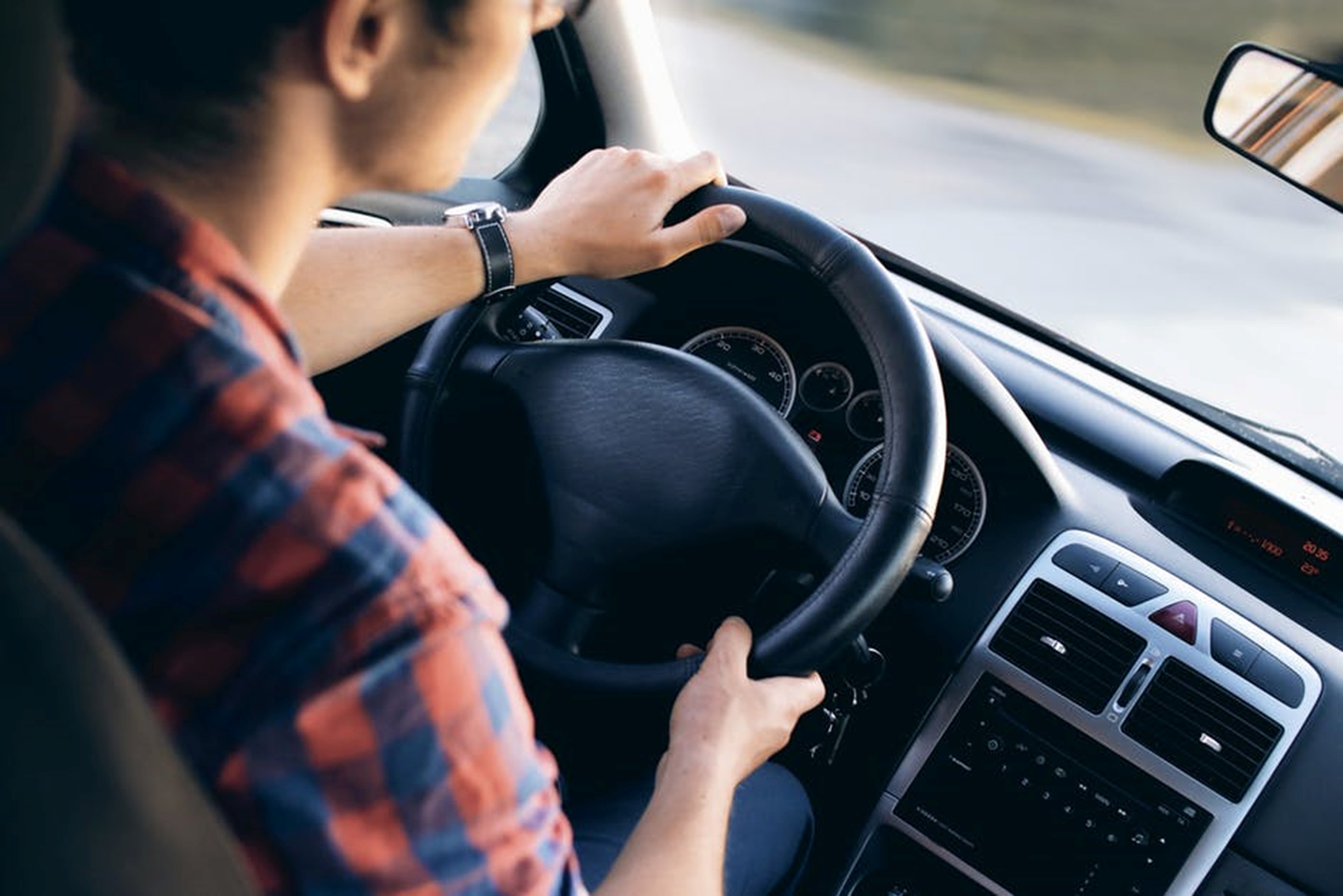 Photo of young man driving